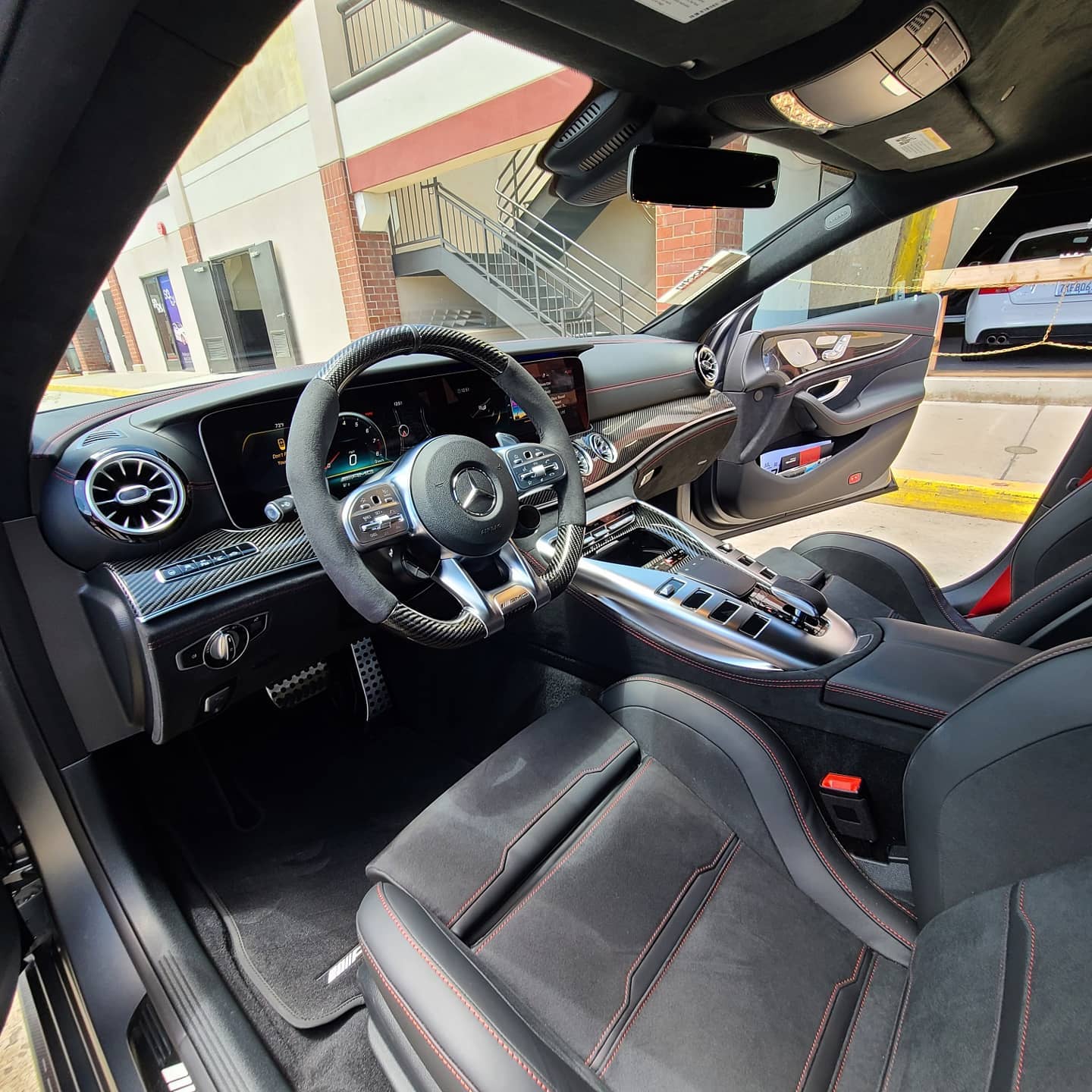 A clean, freshly detailed Mercedes interior with spotless seats and dashboard